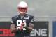 FOXBORO, MA - JULY 26: Jamie Collins #91 walks into position during a drill on the first day of New England Patriots Training Camp at Gillette Stadium on July 26, 2013 in Foxboro, Massachusetts. (Photo by Jim Rogash/Getty Images)