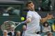 Grigor Dimitrov of Bulgaria returns to Luke Saville of Australia during their men's singles match at the All England Lawn Tennis Championships in Wimbledon, London, Wednesday, June 25, 2014. (AP Photo/Ben Curtis)