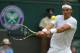Rafael Nadal of Spain plays a return to Lukas Rosol of the Czech Republic during their men's singles match at the All England Lawn Tennis Championships in Wimbledon, London, Thursday, June 26, 2014. (AP Photo/Pavel Golovkin)