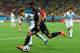 SAO PAULO, BRAZIL - JUNE 26: Divock Origi of Belgium controls the ball as Kim Young-Gwon of South Korea gives chase during the 2014 FIFA World Cup Brazil Group H match between South Korea and Belgium at Arena de Sao Paulo on June 26, 2014 in Sao Paulo, Brazil. (Photo by Stu Forster/Getty Images)