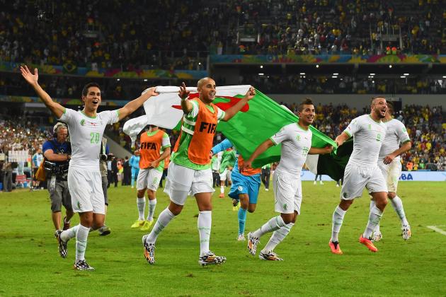 CURITIBA, BRAZIL - JUNE 26: Aissa Mandi (L) and Madjid Bougherra of Algeria celebrate with teammates after a 1-1 tie during the 2014 FIFA World Cup Brazil Group H match between Algeria and Russia at Arena da Baixada on June 26, 2014 in Curitiba, Brazil. (Photo by Matthias Hangst/Getty Images)