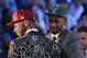Andrew Wiggins, left, and Jabari Parker stop for television interviews after being selected as the top two picks in the 2014 NBA draft, Thursday, June 26, 2014, in New York. Wiggins was selected number one by the Cleveland Cavaliers and Parker was chosen number two by the Milwaukee Bucks. (AP Photo/Kathy Willens)