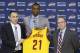 Cleveland Cavaliers head coach David Blatt, left to right, Andrew Wiggins and general manager David Griffin hold up Wiggins jersey during a new conference Friday, June 27, 2014, in Independence, Ohio. (AP Photo/Tony Dejak)