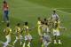 Brazil's goalkeeper Julio Cesar, top right, is congratulated by his teammates as Chile's Gonzalo Jara, top left, walks past after the World Cup round of 16 soccer match between Brazil and Chile at the Mineirao Stadium in Belo Horizonte, Brazil, Saturday, June 28, 2014. Brazil won 3-2 on penalties after the match ended 1-1 draw after extra-time. (AP Photo/Hassan Ammar)