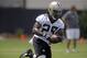 New Orleans Saints running back Khiry Robinson (29) carries during minicamp at their NFL football training facility in Metairie, La., Thursday, June 12, 2014. (AP Photo/Gerald Herbert)