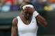 Serena Williams of U.S. gestures after losing a point to Alize Cornet of France during their women's singles match at the All England Lawn Tennis Championships in Wimbledon, London, Saturday, June 28, 2014. (AP Photo/Sang Tan)