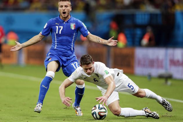 Italy's Ciro Immobile (17) backs away from England's Gary Cahill (5) as Cahill falls chasing the ball during the group D World Cup soccer match between England and Italy at the Arena da Amazonia in Manaus, Brazil, Saturday, June 14, 2014. (AP Photo/Marcio Jose Sanchez)