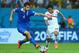 RECIFE, BRAZIL - JUNE 29: Konstantinos Manolas of Greece is challenged by Randall Brenes of Costa Rica during the 2014 FIFA World Cup Brazil Round of 16 match between Costa Rica and Greece at Arena Pernambuco on June 29, 2014 in Recife, Brazil. (Photo by Jeff Gross/Getty Images)