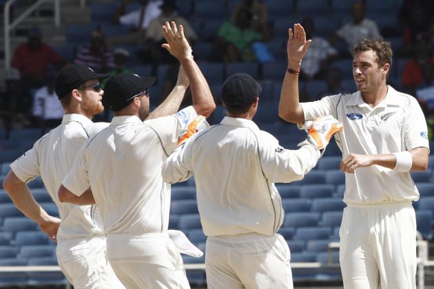 New Zealand's bowler Tim Southee, right, is congratulated by teammates after taking the wicket of West Indies batsman Kieran Powell, who was caught behind for a duck during the second innings on the fourth day of their first cricket Test match in Kingston, Jamaica, Wednesday, June 11, 2014. (AP Photo/Arnulfo Franco)