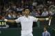 Novak Djokovic of Serbia celebrates defeating Jo-Wilfried Tsonga of France in their men's singles match at the All England Lawn Tennis Championships in Wimbledon, London, Monday, June 30, 2014. (AP Photo/Pavel Golovkin)