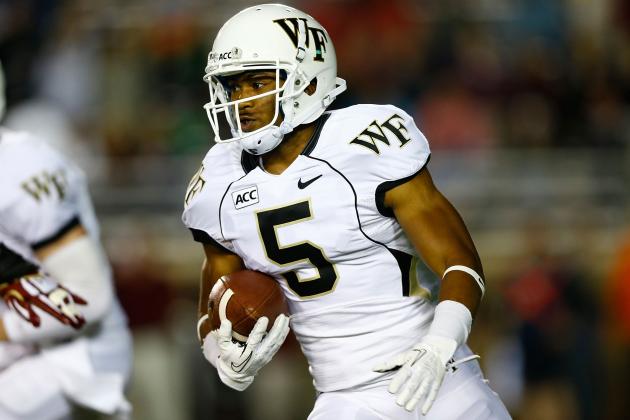CHESTNUT HILL, MA - SEPTEMBER 6: Orville Reynolds #5 of the Wake Forest Demon Deacons runs with the ball in the first quarter against the Boston College Eagles during the game on September 6, 2013 at Alumni Stadium in Chestnut Hill, Massachusetts. (Photo by Jared Wickerham/Getty Images)