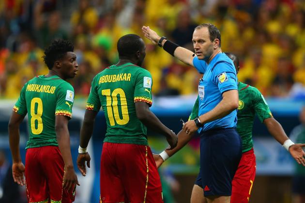 BRASILIA, BRAZIL - JUNE 23: Referee Jonas Eriksson speaks to Benjamin Moukandjo (L) and Vincent Aboubakar of Cameroon during the 2014 FIFA World Cup Brazil Group A match between Cameroon and Brazil at Estadio Nacional on June 23, 2014 in Brasilia, Brazil.  (Photo by Clive Brunskill/Getty Images)