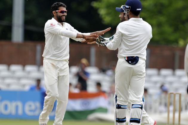DERBY, ENGLAND - JULY 1: Ravindra Jadeja (L) of India celebrates after he takes the wicket of Derbyshire's Ben Slater during day one of the tour match between Derbyshire and India at The 3aaa County Ground on July 1, 2014 in Derby, England. (Photo by Clint Hughes/Getty Images)