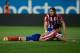 MADRID, SPAIN - APRIL 18: Filipe Luis (R) of Atletico de Madrid assists his teammate Diego Costa (L) after being tackled by Cristian Sapunaru of Elche FC during the La Liga match between Club Atletico de Madrid and Elche FC at Vicente Calderon Stadium on April 18, 2014 in Madrid, Spain. (Photo by Gonzalo Arroyo Moreno/Getty Images)