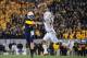 Nov 9, 2013; Morgantown, WV, USA; West Virginia Mountaineers quarterback Paul Millard (14) has his pass deflected by Texas Longhorns cornerback Quandre Diggs (6) in overtime at Milan Puskar Stadium. Mandatory Credit: Evan Habeeb-USA TODAY Sports