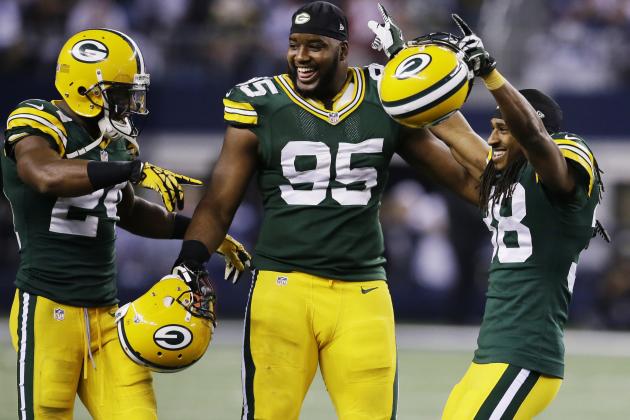 Green Bay Packers cornerback Jarrett Bush (24) defensive end Datone Jones (95) and cornerback Tramon Williams (38) celebrate after beating Dallas Cowboys 37-36 at an NFL football game, Sunday, Dec. 15, 2013, in Arlington, Texas. (AP Photo/Tony Gutierrez)