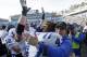Duke coach David Cutcliffe hugs David Helton (47) following Duke's 27-25 win over North Carolina in an NCAA college football game in Chapel Hill, N.C., Saturday, Nov. 30, 2013. (AP Photo/Gerry Broome)