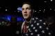 Chris Weidman, of Baldwin, N.Y., walks after defeating Anderson Silva, of Brazil, during the UFC 168 mixed martial arts middleweight championship bout on Saturday, Dec. 28, 2013, in Las Vegas. Weidman won during the second round by a technical knockout after Silva was injured. (AP Photo/David Becker)