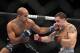 Frankie Edgar,right, in action against B. J. Penn during their lightweight title fight on Saturday, Aug. 28, 2010 at the TD Garden in Boston, MA. Edgar retained his title via unanimous decision. (AP Photo/Gregory Payan)