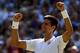 LONDON, ENGLAND - JULY 04: Novak Djokovic of Serbia celebrates after winning his Gentlemen's Singles semi-final match against Grigor Dimitrov of Bulgaria on day eleven of the Wimbledon Lawn Tennis Championships at the All England Lawn Tennis and Croquet Club on July 4, 2014 in London, England. (Photo by Clive Brunskill/Getty Images)
