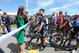 Kate, Duchess of Cambridge, speaks with a cyclist, before officially starting the Tour de France at Harewood House near Leeds England. The 198 competitors in the 101st Tour de France will start their grueling three-week ride through four countries before ending the world's greatest cycling race in Paris on July 27. (AP Photo/Asadour Guzelian, Pool)