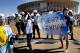 Fans of Argentina's national soccer team hold a banner with a message that reads in Spanish;