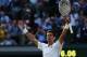 LONDON, ENGLAND - JULY 06: Novak Djokovic of Serbia celebrates championship point and winning the Gentlemen's Singles Final match against Roger Federer of Switzerland on day thirteen of the Wimbledon Lawn Tennis Championships at the All England Lawn Tennis and Croquet Club on July 6, 2014 in London, England. (Photo by Matthew Stockman/Getty Images)