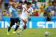 FORTALEZA, BRAZIL - JUNE 14: Yeltsin Tejeda of Costa Rica holds off a challenge by Egidio Arevalo Rios of Uruguay during the 2014 FIFA World Cup Brazil Group D match between Uruguay and Costa Rica at Castelao on June 14, 2014 in Fortaleza, Brazil. (Photo by Robert Cianflone/Getty Images)