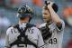 Chicago White Sox starting pitcher Chris Sale, right, speaks with catcher Tyler Flowers on the mount after Baltimore Orioles' Delmon Young singled in the first inning of a baseball game, Monday, June 23, 2014, in Baltimore. Baltimore scored two runs in the first. (AP Photo/Patrick Semansky)