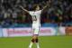 Germany's Thomas Mueller raises his arms after Germany defeated Algeria 2-1 in extra time during the World Cup round of 16 soccer match between Germany and Algeria at the Estadio Beira-Rio in Porto Alegre, Brazil, Monday, June 30, 2014. (AP Photo/Kirsty Wigglesworth)