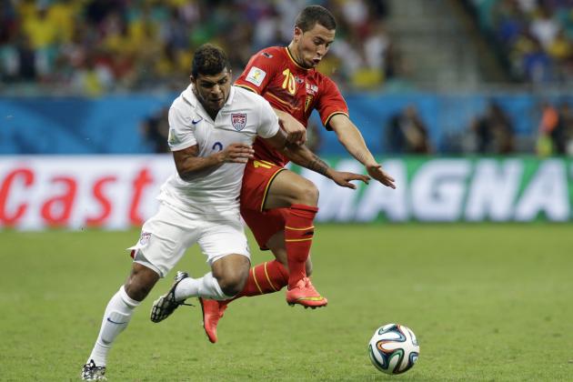 United States' DeAndre Yedlin, left, challenges Belgium's Eden Hazard during the World Cup round of 16 soccer match between Belgium and the USA at the Arena Fonte Nova in Salvador, Brazil, Tuesday, July 1, 2014. (AP Photo/Matt Dunham)