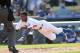 Los Angeles Dodgers’ Dee Gordon attempts to score from third base on a passed ball by St. Louis Cardinals' Lance Lynn but was tagged out by Lynn in the second inning of a baseball game Saturday, June 28, 2014, in Los Angeles. (AP Photo/Jayne Kamin-Oncea)