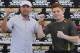 In this photo taken on on Tuesday, Sept. 14, 2010, Oscar De La Hoya, President of Golden Boy Promotions, left, presents Mexican welterweight boxer Saul