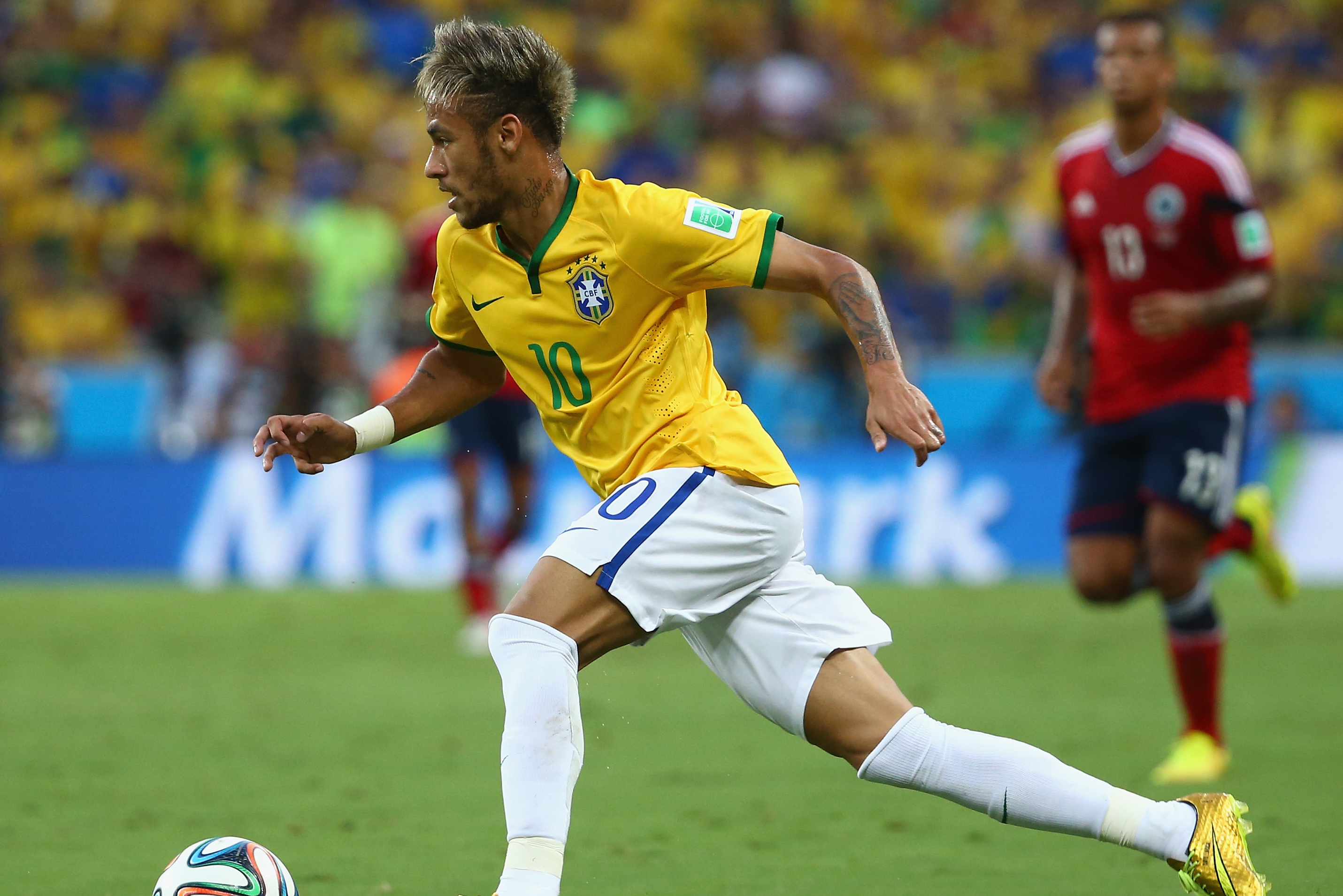 Neymar of Brazil takes a free kick during the FIFA World Cup 2014