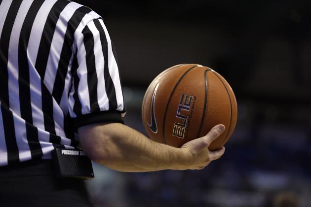 A referee holds a ball during the first half of an NCAA college basketball game between Saint Louis and Fordham Saturday, Jan. 18, 2014, in St. Louis. (AP Photo/Jeff Roberson)