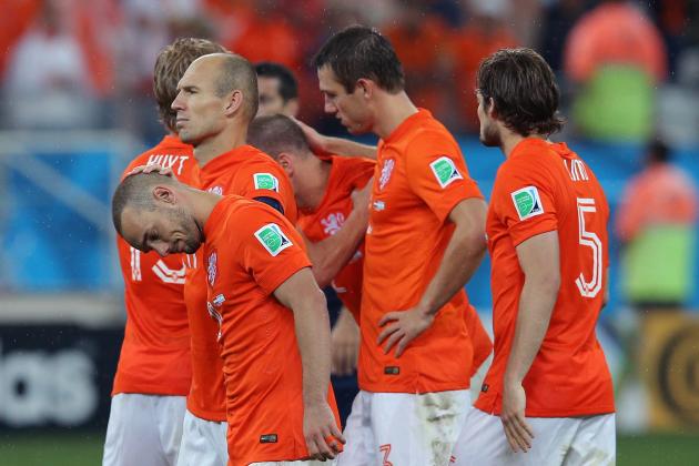 SAO PAULO, BRAZIL - JULY 09: Wesley Sneijder and Arjen Robben of the Netherlands react with teammates after being defeated in a penalty shootout by Argentina during the 2014 FIFA World Cup Brazil Semi Final match between the Netherlands and Argentina at Arena de Sao Paulo on July 9, 2014 in Sao Paulo, Brazil.  (Photo by Dean Mouhtaropoulos/Getty Images)