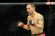 Jul 6, 2013; Las Vegas, NV, USA; Frankie Edgar (red gloves) during his Featherweight Bout against Charles Oliveira (not pictured) at the MGM Grand Garden Arena. Edgar won. Mandatory Credit: Jayne Kamin-Oncea-USA TODAY Sports