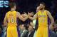 Apr 8, 2014; Los Angeles, CA, USA; Los Angeles Lakers guard Steve Nash (10) is congratulated by guard Kendall Marshall (12) after passing Mark Jackson (not pictured) to move into third on the all-time NBA assist list in the second quarter against the Houston Rockets at Staples Center. Mandatory Credit: Kirby Lee-USA TODAY Sports