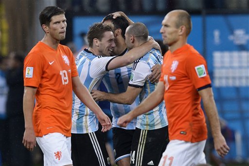 Argentina players celebrate after winning a shootout at the end of the World Cup semifinal soccer match between the Netherlands and Argentina at the Itaquerao Stadium in Sao Paulo Brazil, Wednesday, July 9, 2014. Argentina won 4-2 on penalties after the match ended 0-0 after extra time.  (AP Photo/Manu Fernandez)