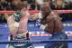 Canelo Alvarez, left, throws a punch against Floyd Mayweather Jr. during a 152-pound title fight, Saturday, Sept. 14, 2013, in Las Vegas. (AP Photo/Isaac Brekken)