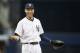 New York Yankees shortstop Derek Jeter reacts to a coach while waiting for the start of a baseball game against the Oakland Athletics at Yankee Stadium in New York, Wednesday, June 4, 2014. (AP Photo/Kathy Willens)