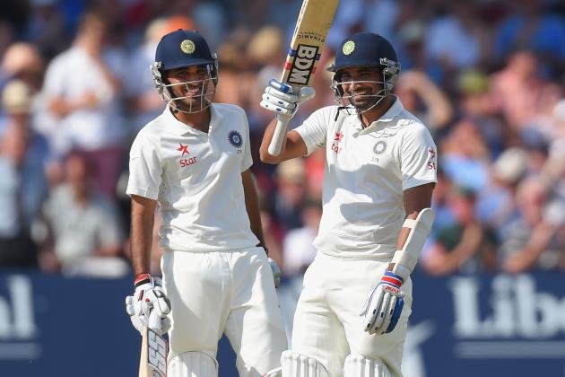 NOTTINGHAM, ENGLAND - JULY 10:  India batsman Mohammed Shami (r) and partner Bhuvneshwar Kumar celebrate their 100 partnership for the last wicket and Shami's 50 which he had reached with a straight six during day two of the 1st  Investec Test Match between England and India at  Trent Bridge on July 10, 2014 in Nottingham, England.  (Photo by Stu Forster/Getty Images)