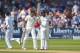NOTTINGHAM, ENGLAND - JULY 10: India batsman Mohammed Shami (r) and partner Bhuvneshwar Kumar celebrate their 100 partnership for the last wicket and Shami's 50 which he had reached with a straight six during day two of the 1st Investec Test Match between England and India at Trent Bridge on July 10, 2014 in Nottingham, England. (Photo by Stu Forster/Getty Images)
