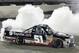 Erik Jones does a burnout after winning the NASCAR Trucks auto race, Friday, July 11, 2014, at Iowa Speedway in Newton, Iowa. (AP Photo/Charlie Neibergall)