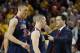 Arizona head coach Sean Miller, right, talks with his players Kaleb Tarczewski (35), and T.J. McConnell during the first overtime of an NCAA college basketball game against Arizona State, Friday, Feb. 14, 2014, in Tempe, Ariz. Arizona State defeated Arizona 69-66 in double overtime. (AP Photo/Ross D. Franklin)