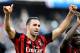 AC Milan's Adil Rami, left, and teammate Michael Essien celebrate at the end of a Serie A soccer match between Sampdoria and AC Milan, at the Luigi Ferraris stadium in Genoa, Italy, Sunday, Feb. 23, 2014. AC Milan won 2-0. (AP Photo/Carlo Baroncini)