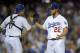 Los Angeles Dodgers starting pitcher Clayton Kershaw, right, is congratulated by catcher A.J. Ellis after they defeated the San Diego Padres 2-1 in a baseball game on Thursday, July 10, 2014, in Los Angeles. (AP Photo/Mark J. Terrill)