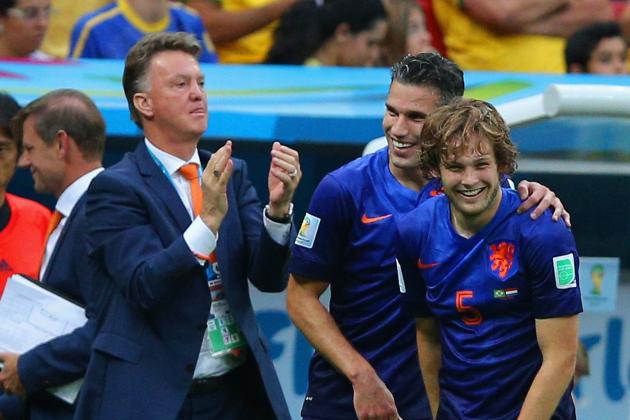 BRASILIA, BRAZIL - JULY 12: Daley Blind of the Netherlands (R) celebrates scoring his team's second goal with Robin van Persie and head coach Louis van Gaal during the 2014 FIFA World Cup Brazil Third Place Playoff match between Brazil and the Netherlands at Estadio Nacional on July 12, 2014 in Brasilia, Brazil. (Photo by Dean Mouhtaropoulos/Getty Images)