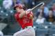 Jul 10, 2014; Arlington, TX, USA; Los Angeles Angels center fielder Mike Trout (27) singles during the first inning against the Texas Rangers at Globe Life Park in Arlington. Mandatory Credit: Kevin Jairaj-USA TODAY Sports