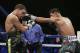 Abner Mares, right, lands a punch on Jonathan Oquendo during their featherweight fight , Saturday, July 12, 2014, in Las Vegas. (AP Photo/John Locher)